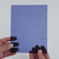Video of the Periwinkle Cathedral glass plate in transparent purple, 15x19cm, held up and tilted to show its pattern and transparency